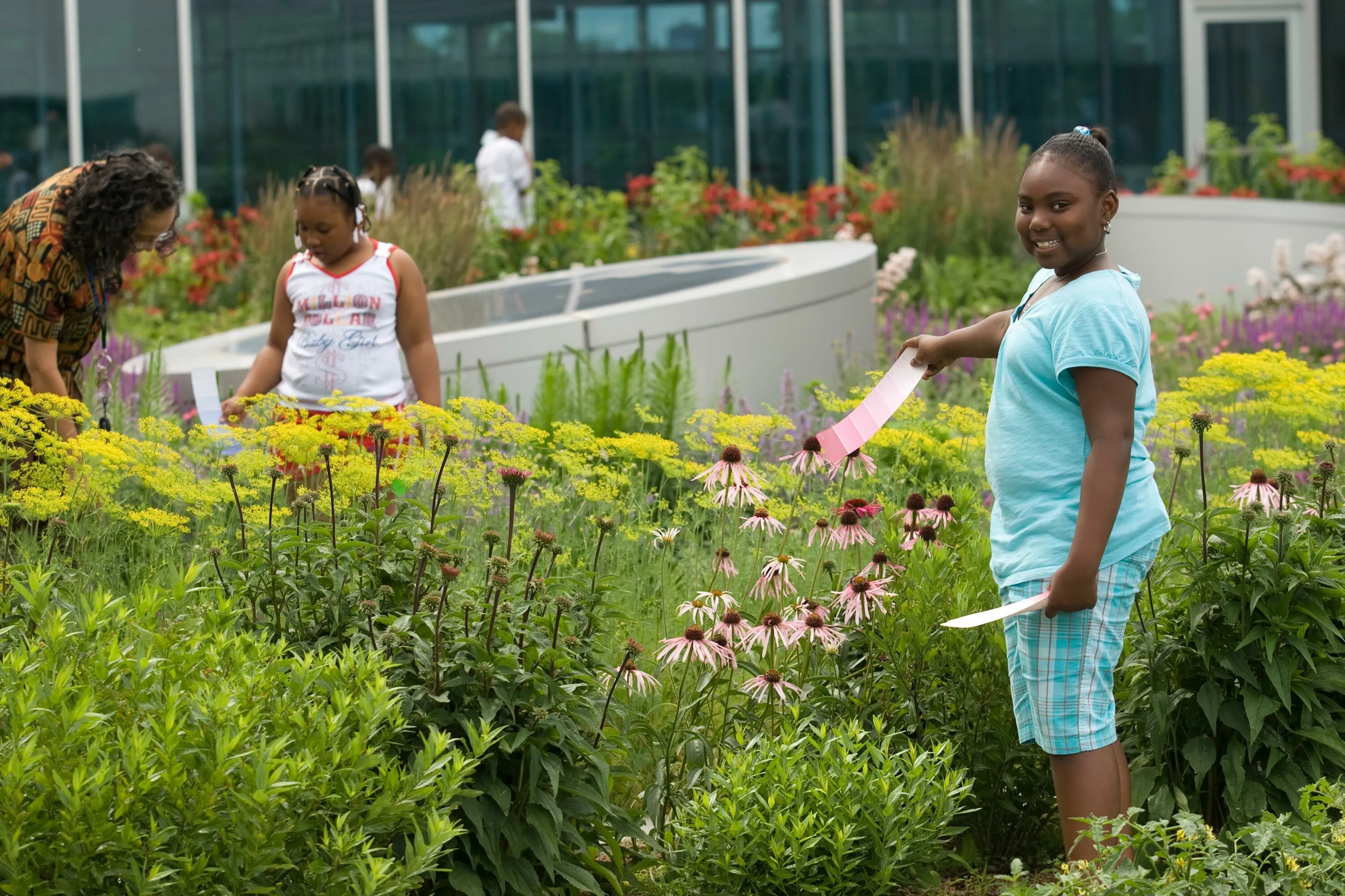 4 children gardening flowers gary comer youth center hoerrschaudt